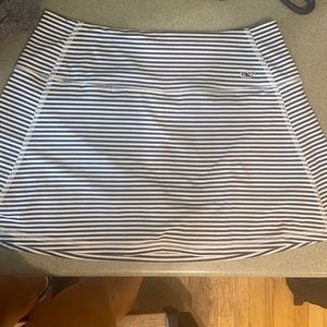 Worn once. Navy stripped tennis skirt